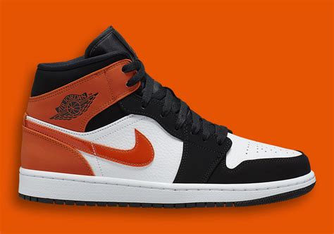 Air Jordan 1 Mid Black White Starfish Orange 554724-058 | SneakerNews.com