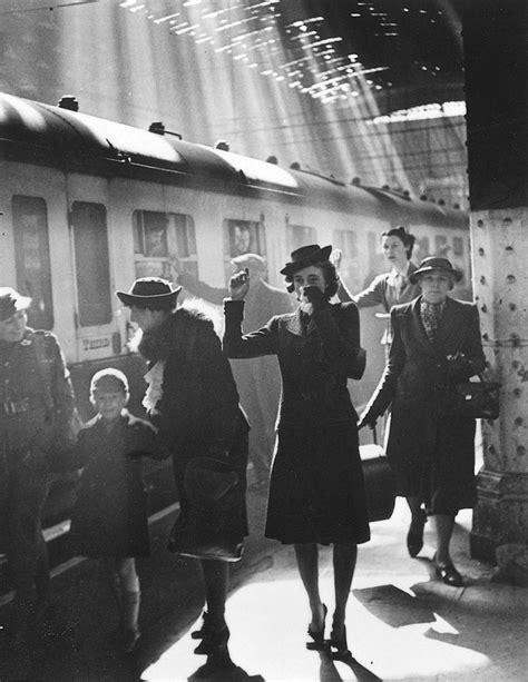 Bert Hardy. Tearful wives waving goodbye as a troop train pulls out of a station. Wartime Terminus,