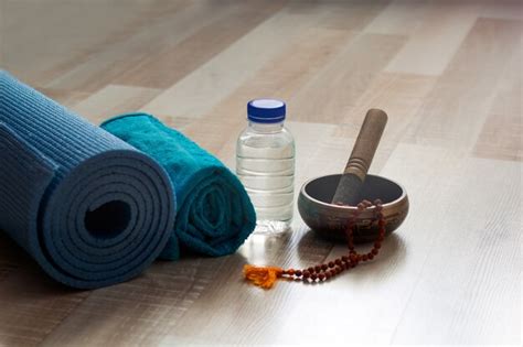 Premium Photo | Yoga set with mat,towel and water