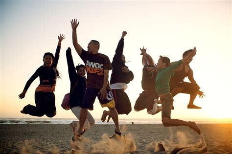 File:People jumping on the beach.jpg - Wikimedia Commons