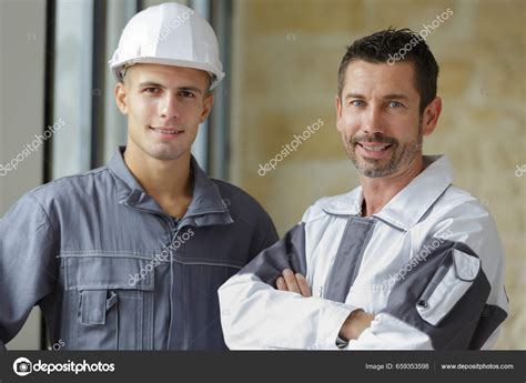 Portrait Two Construction Workers Wearing Hard Hats Stock Photo by ©photography33 659353598