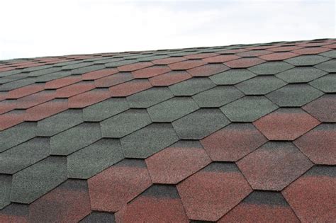 Premium Photo | Photo of a fragment of bitumen roofing shingles of different colors fragment of ...