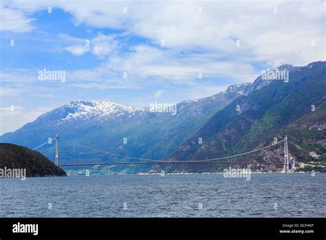 Controversial new Norway Sky or Hardanger fjord bridge under construction across ...