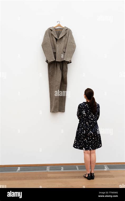 Woman looking at art installation Felt Suit ( Filzanzug) by Joseph ...