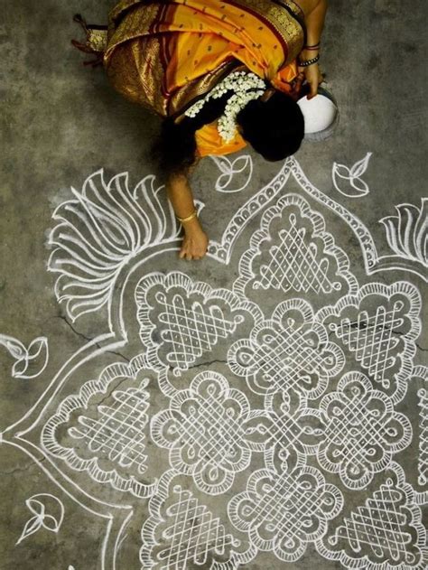 Woman making a kolam in south India: "Especially during the harvest season, you'll see many ...