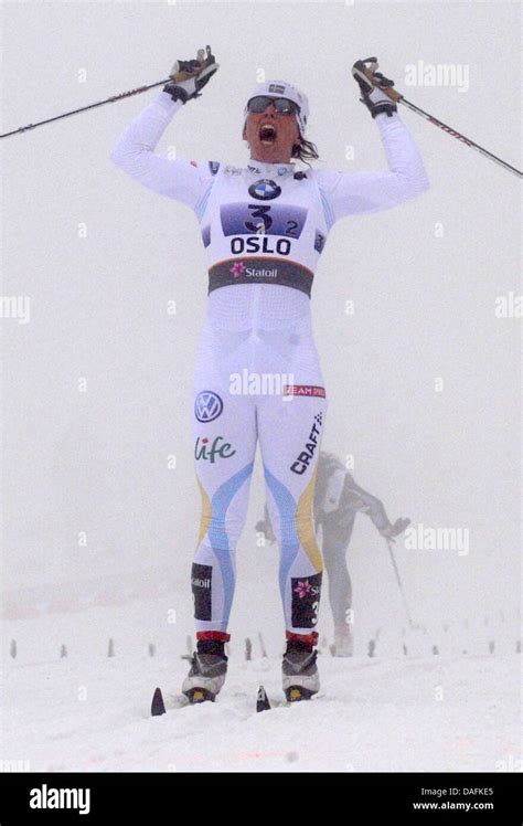 Winner Charlotte Kalla from Sweden jubilates after crossing the finish line in the Cross Country ...