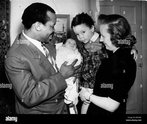 First president of Botswana SERETSE KHAMA, left his wife, RUTH WILLIAMS KHAMA, right, hold two ...