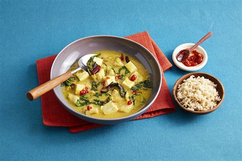 Delicious and nutritious fish curry with coconut milk and greens