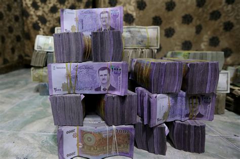 Syrian pound devalues further amid central bank head's removal | Daily ...