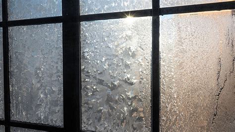 What causes frost on the inside of windows?