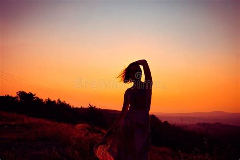 Silhouette of a Girl at Sunset Stock Photo - Image of mountain, girl: 126253976