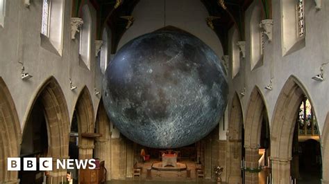 Giant moon sculpture suspended in Leicester Cathedral - BBC News