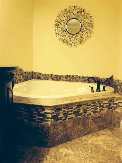 We really like the look of natural river rock for a backsplash and chose a combination of ...