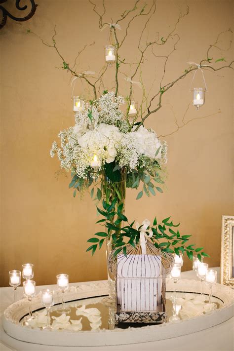 Tall, White Flower-and-Branch Centerpiece With Hanging Candles | Candle wedding centerpieces ...