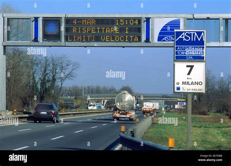 Speed limit signs change with conditions along Autostrada near Milan Italy Stock Photo - Alamy