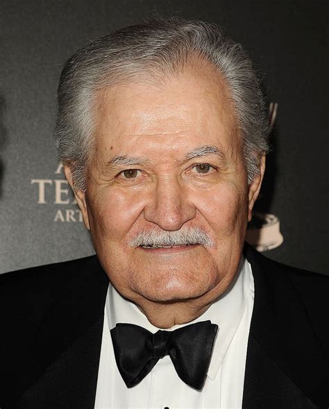 an older man in a tuxedo and bow tie