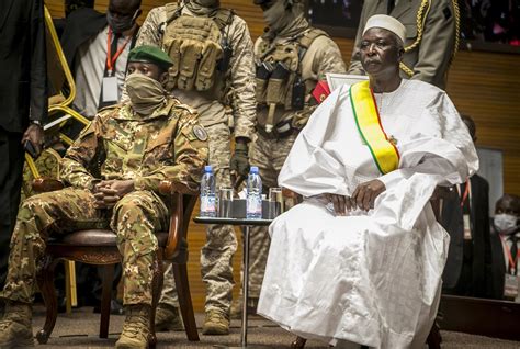 Mali junta leader sworn in as president after 2nd coup | AP News