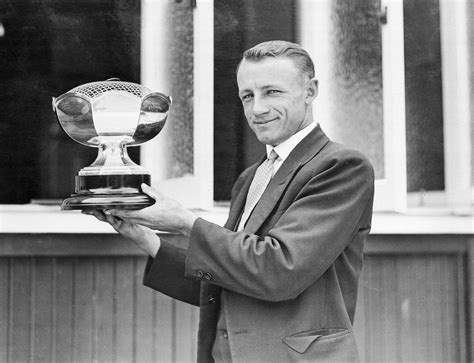 Donald Bradman holds up a trophy | ESPNcricinfo.com