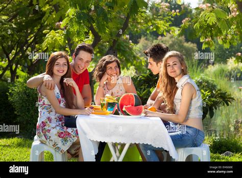 Young people at park. Young people at park enjoy a picnic Stock Photo ...