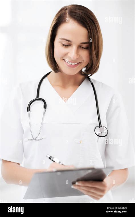 doctor with stethoscope writing prescription Stock Photo - Alamy