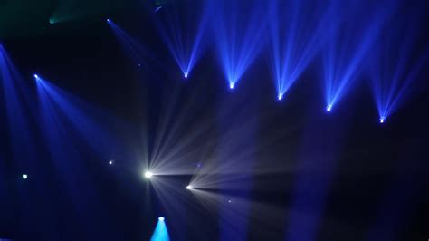 Stage Ray Of Light In Concert Hall. Professional lighting and show effects. Blue lights from ...