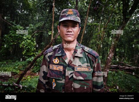 Cambodian soldier by the Ta Krabey temple Stock Photo - Alamy