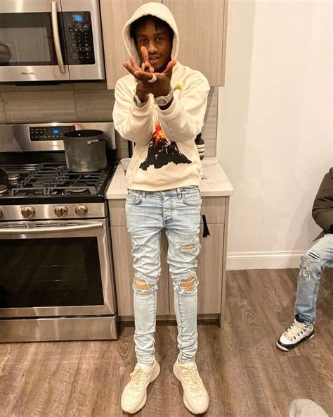 Lil TJay Wearing a White Gucci Hoodie and Sneakers with Amiri Jeans ...