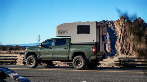 a truck with a camper attached to the back