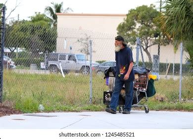 Homeless Man Walking Down Street Pulling Stock Photo 1245485521 | Shutterstock