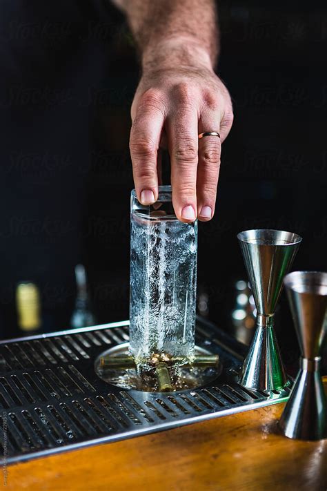 "Unrecognizable Bartender Cleaning Glasses With Splashing Water" by ...