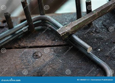 Steel bar bending on table stock photo. Image of plant - 148450112