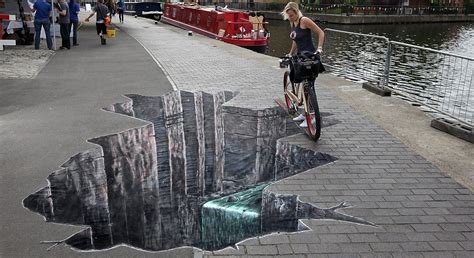 Don't look down now: Cyclists faced with huge 'hole' in the ground on towpath... luckily it's ...