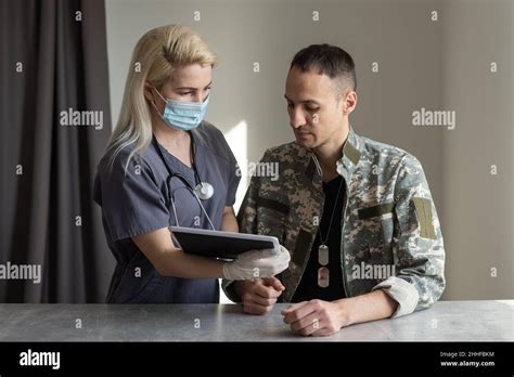 medical worker with military officer patient in hospital Stock Photo ...