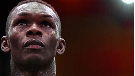 Israel Adesanya reacts following title loss to Sean Strickland at UFC ...