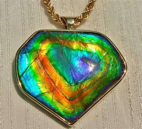 Ammolite pendant set in 14k gold | Ammolite jewelry, Ammolite, Ammolite ...