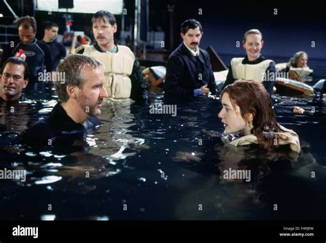 On the set, James Cameron and Kate Winslet / Titanic / 1997 directed Stock Photo, Royalty Free ...