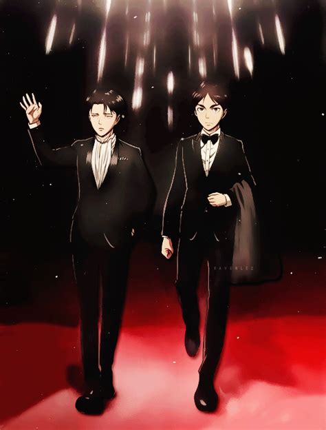 two men in tuxedos are walking on a red carpet with fireworks behind them