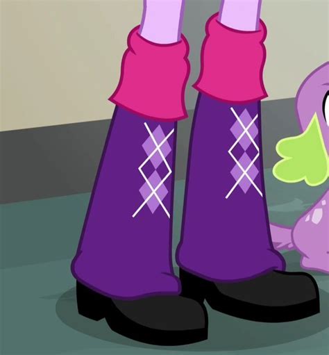 the pinkie is standing next to her purple boots