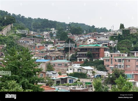 Rural houses in a suburb of Seoul in South Korea with mountains Stock ...