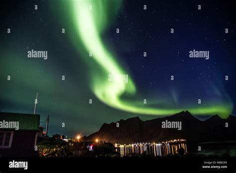 Northern lights above Reine in Lofoten islands in Norway Stock Photo ...