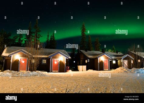 Northern lights over cabins at the Ice hotel in Jukkasjärvi, Sweden ...