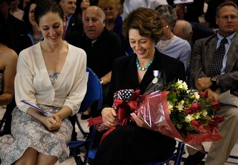 Kathy Abizaid, wife of U.S. Army Gen. John P. Abizaid, receives flowers ...