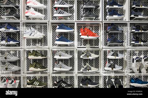 JD Sports store. UK. Adidas trainers/running shoes display Stock Photo ...