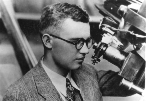 Clyde Tombaugh at the guide scope of the 13-inch astrograph he would use to discover Pluto.