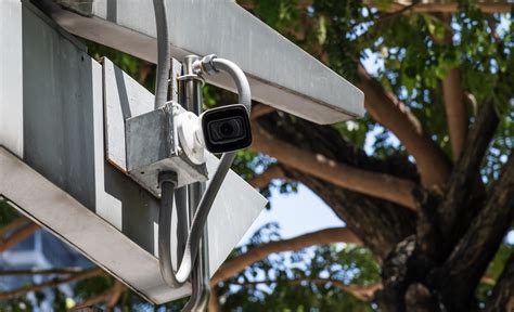 Outdoor white CCTV on building 11175153 Stock Photo at Vecteezy