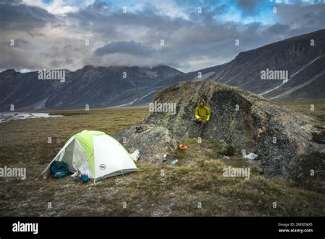 Hiking on arctic valley of Akshayuk Pass, Baffin Island, Canada ...