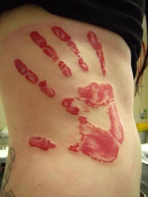 sayuti tattoos designs: baby handprint tattoos