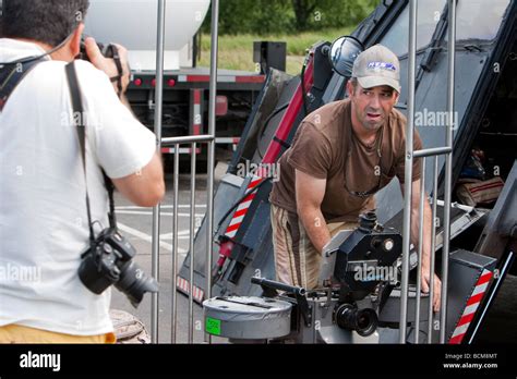 Storm chaser Sean Casey loads an IMAX camera into his Tornado Intercept ...