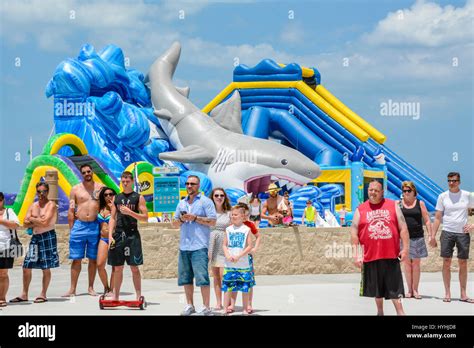 Crowds gather around the entrance to Pier 60 in Clearwater Beach, FL ...