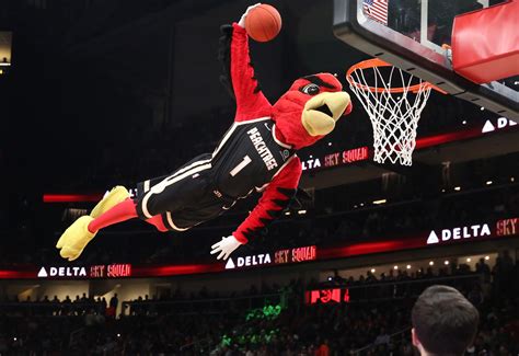 Atlanta Hawks mascot Harry the Hawk dunks during the Atlanta Hawks’ game against the Detroit ...